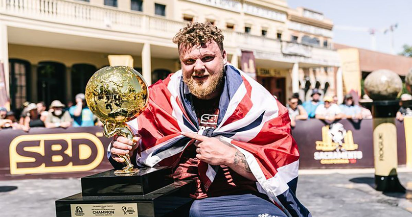 Tom Stoltman with his 2021 trophy after winning his first worlds strongest man.