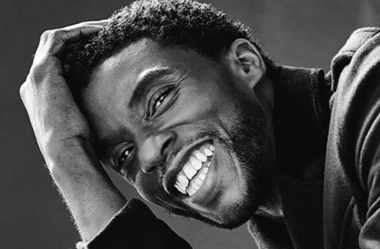black and white portrait of a smiling Chadwick that was shown followed by the sad announcement of his passing.